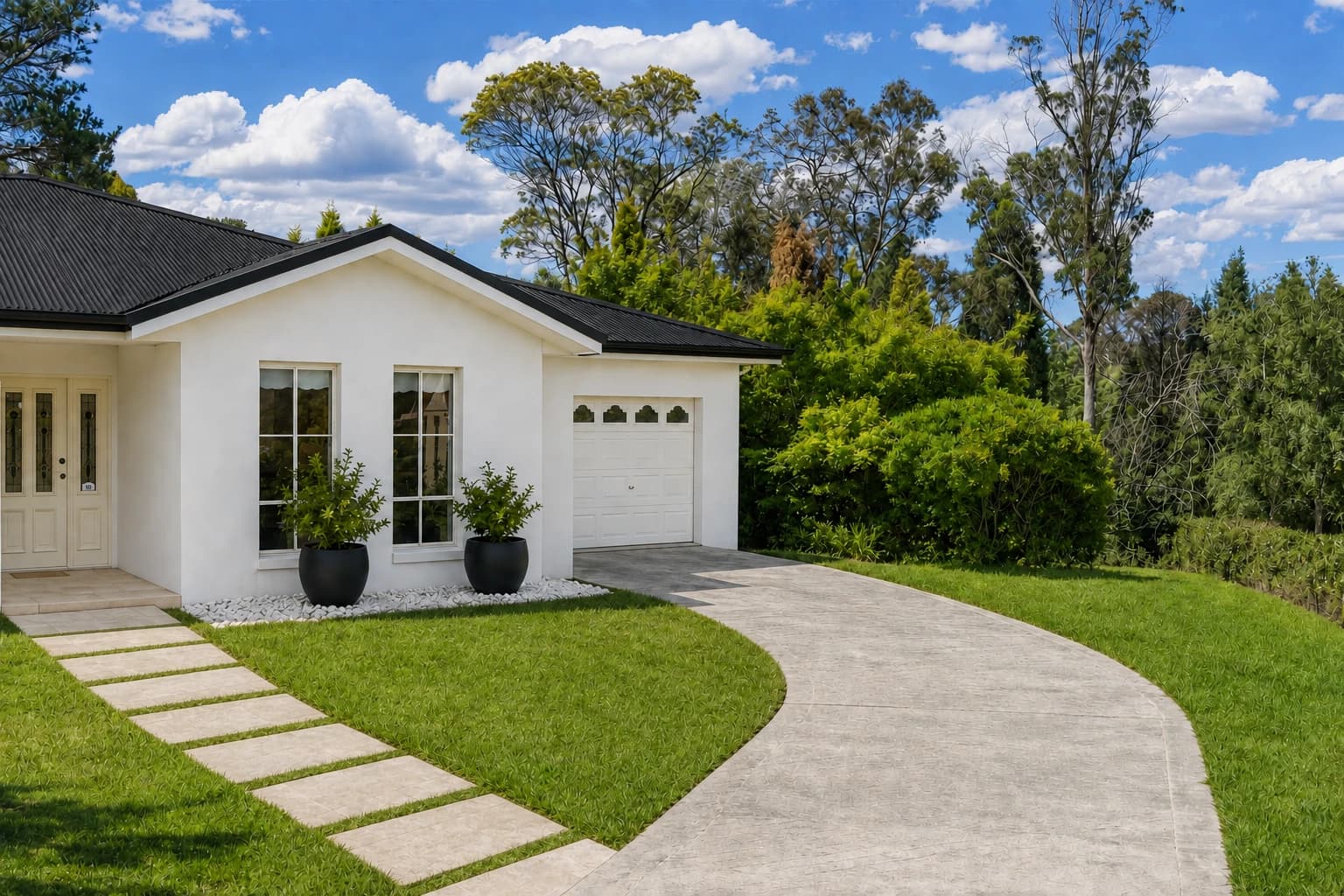 Artist's impression of the entry portico with white render, a black metal roof, pillars removed, black planters and a grass-jointed stone path beside the curved driveway