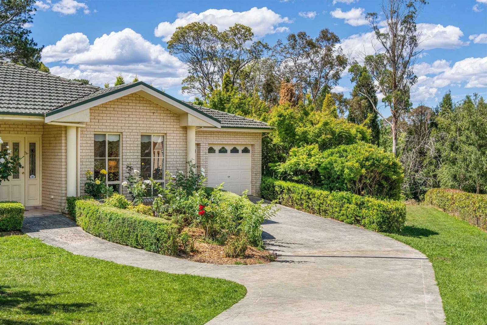 Current front portico, driveway and garage approach
