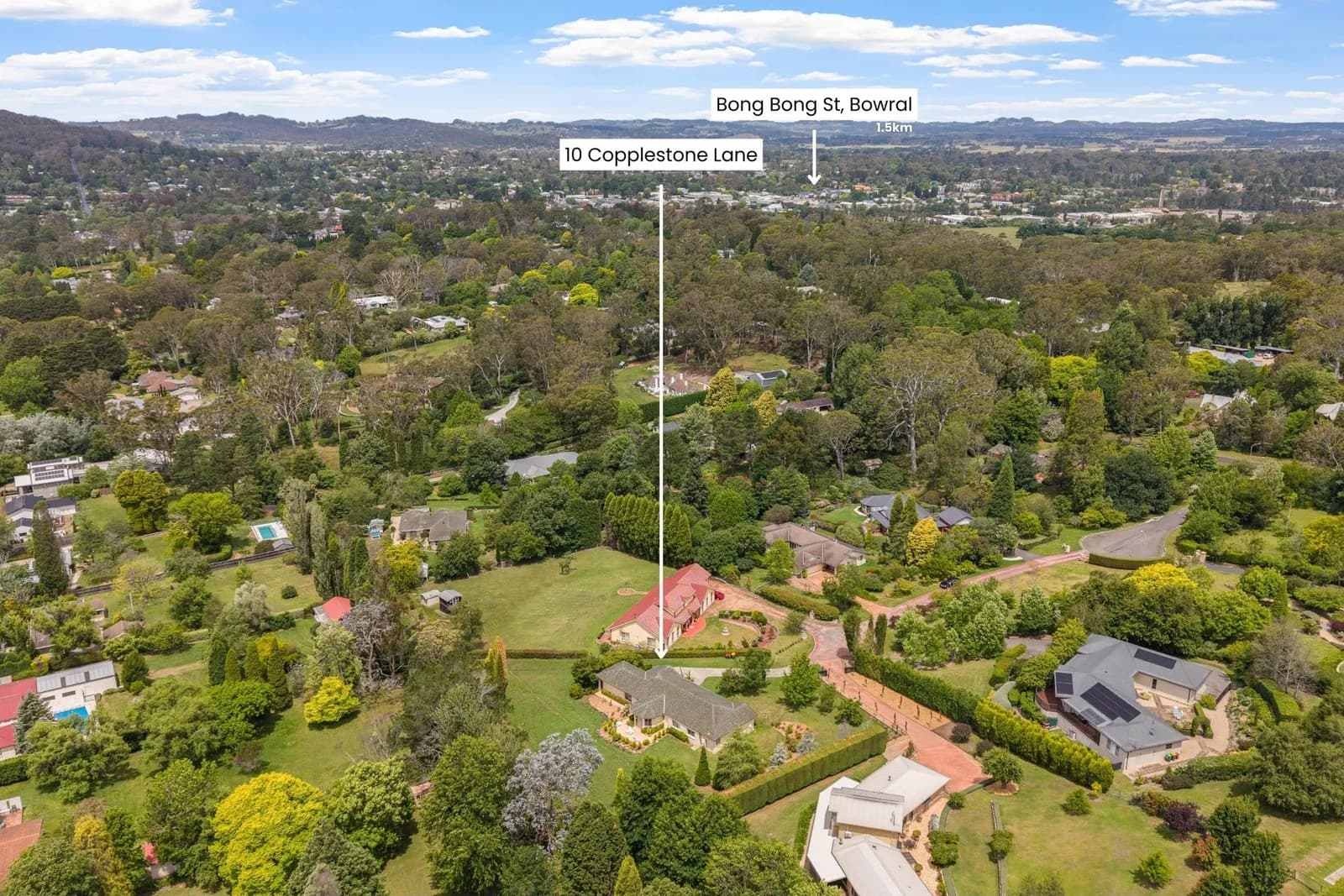 Aerial photograph showing the property in its surrounding streets and tree cover