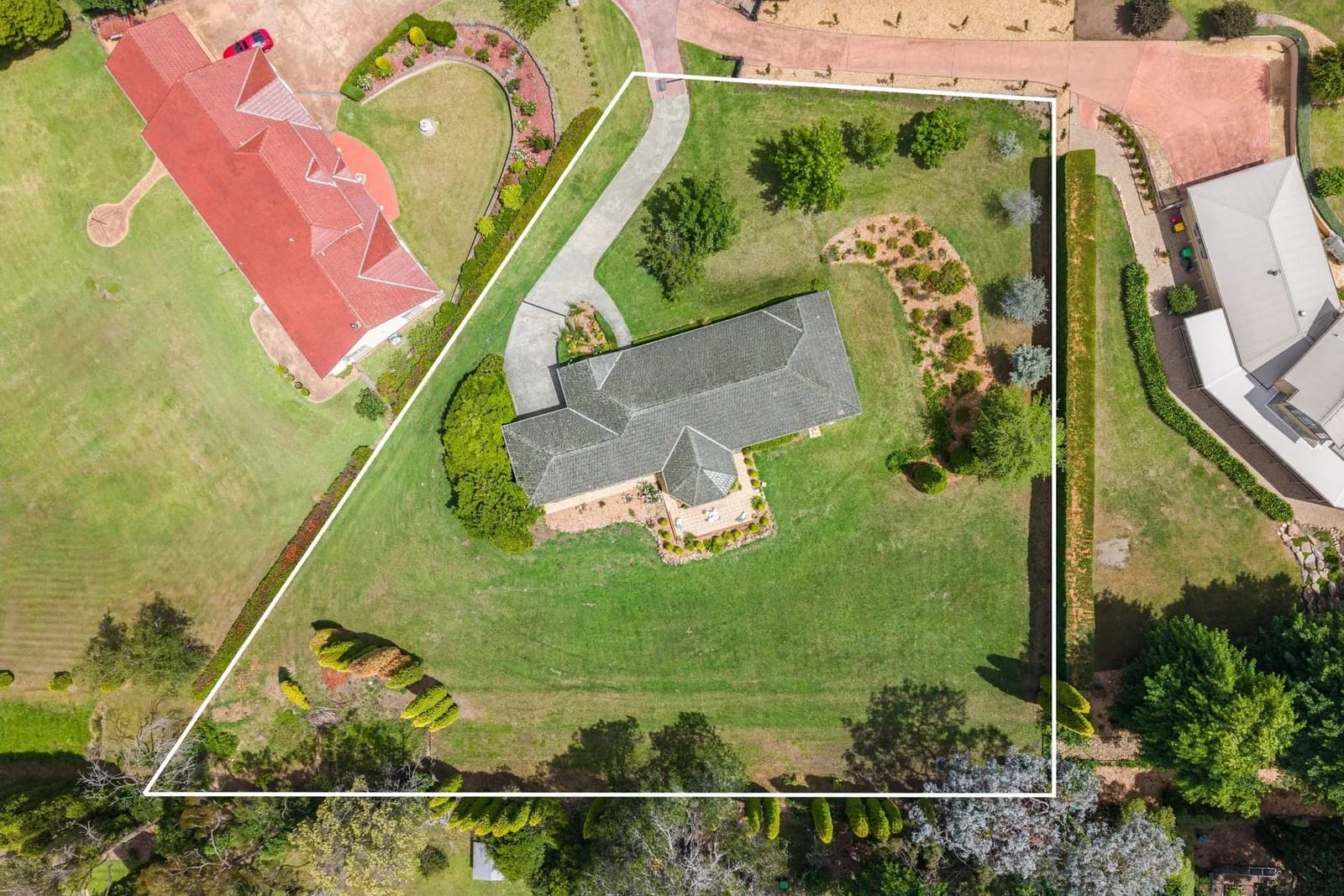 Aerial photograph showing the property boundary and established grounds